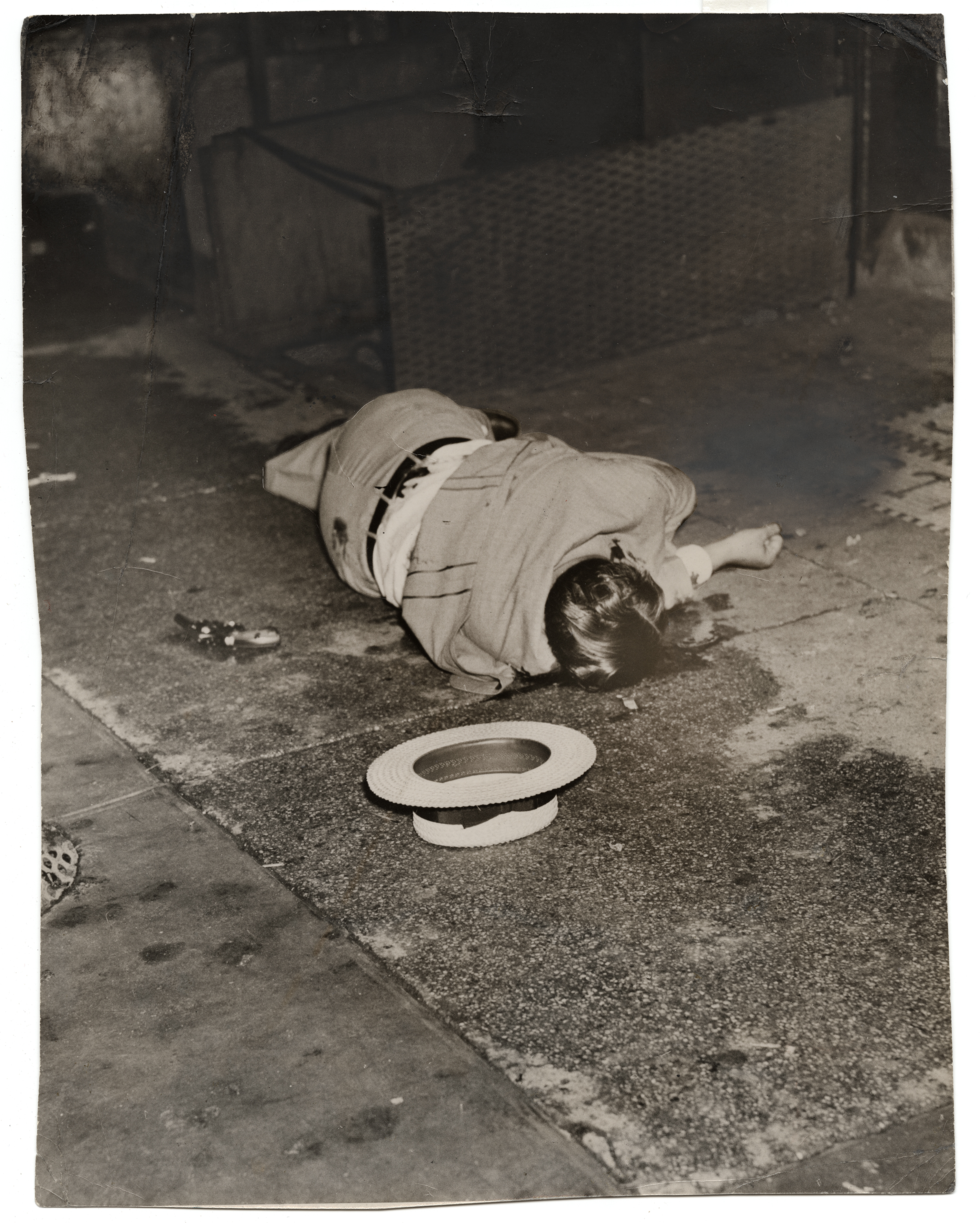  Weegee [Body of Dominick Didato, Elizabeth Street, New York], August 7, 1936 Gelatin silver print © Weegee/International Center of Photography International Center of Photography