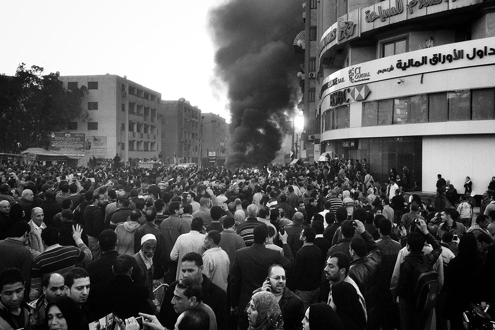 PHOTO JOURNALISM 1ST PLACE, A CAR IS ON FIRE - TALKHA CITY, EGYPT by Chaoyue Pan