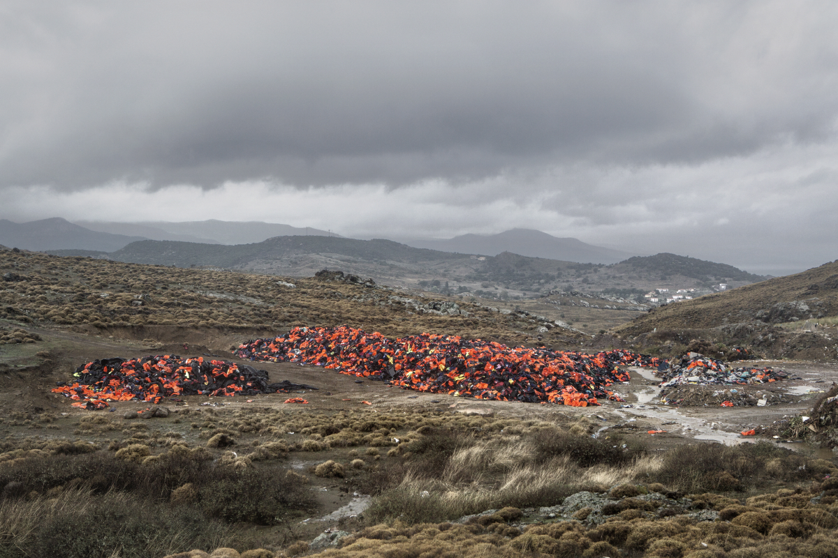 Molyvos, Lesvos, Oct. 23, 2015. A garbage dump near the town of Molyvos with thousands of discarded life jackets, used by refugees and migrants during their journey to Europe. © Alessandro Penso