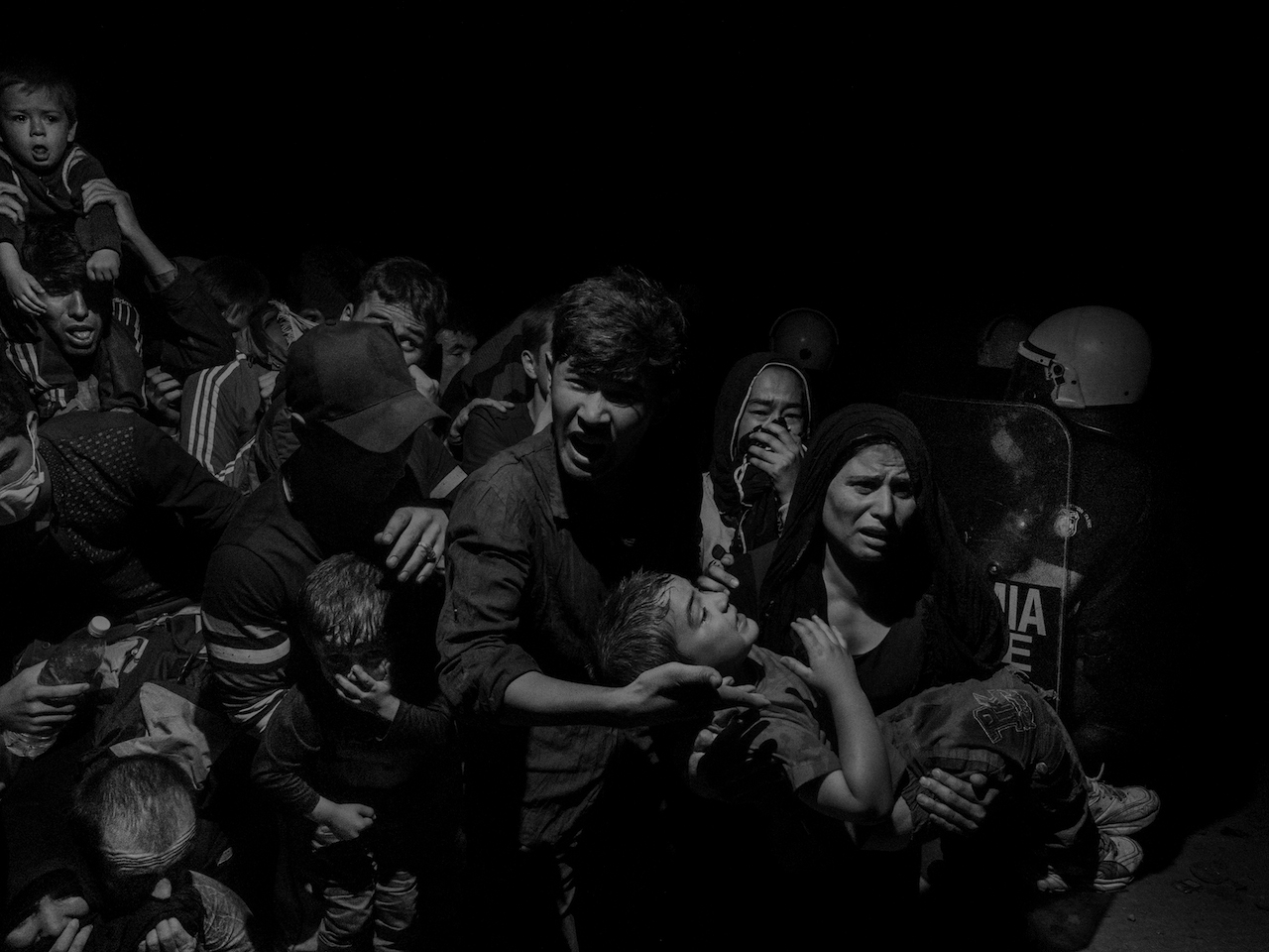 Alex Majoli. Greece, Lesbos. 2015. The refugees and migrant arriving on Lesbos island are transferred to Moria refugee camp where they await registration from authorities before they can move on.