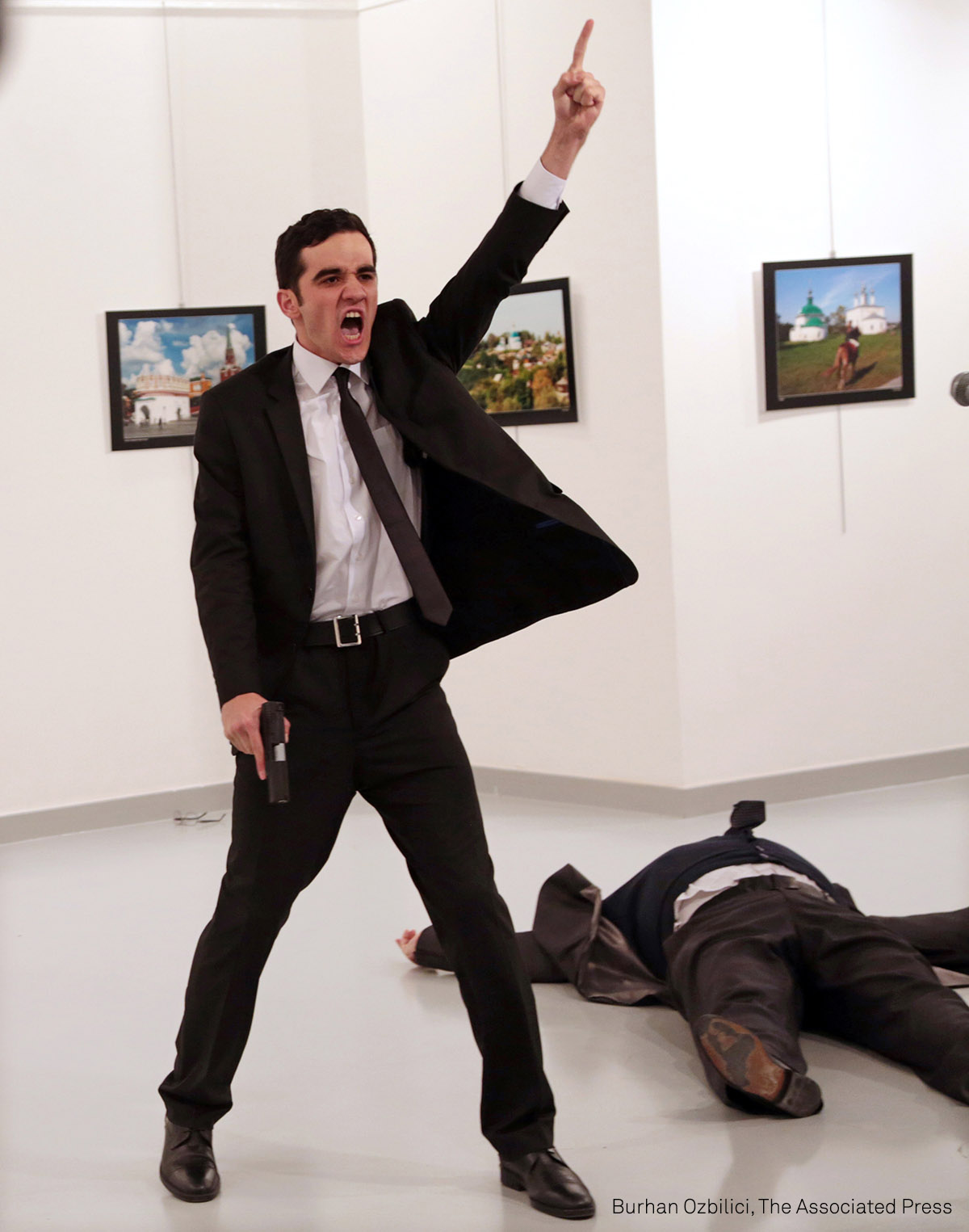 Mevlüt Mert Altıntaş shouts after shooting Andrey Karlov, the Russian ambassador to Turkey, at an art gallery in Ankara, Turkey.