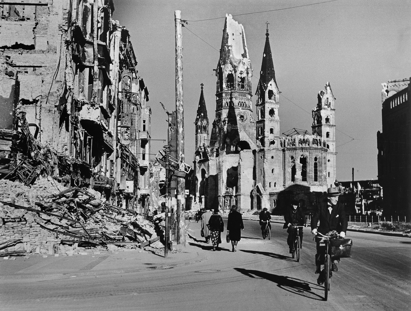 People on street lined with ruined buildings, Berlin, August 1945 © Robert Capa © International Center of Photography/Magnum Photos