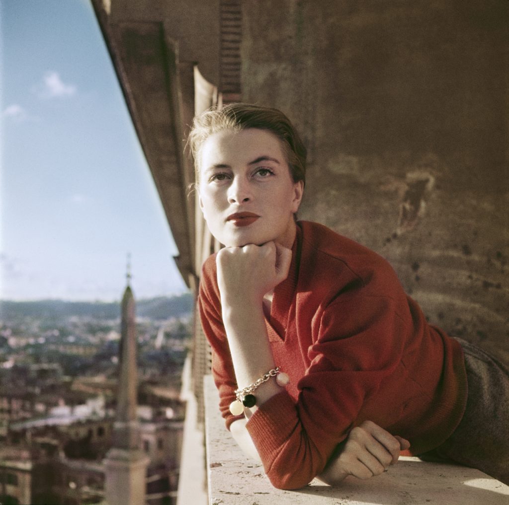 Robert Capa Capucine, French model and actress, on a balcony