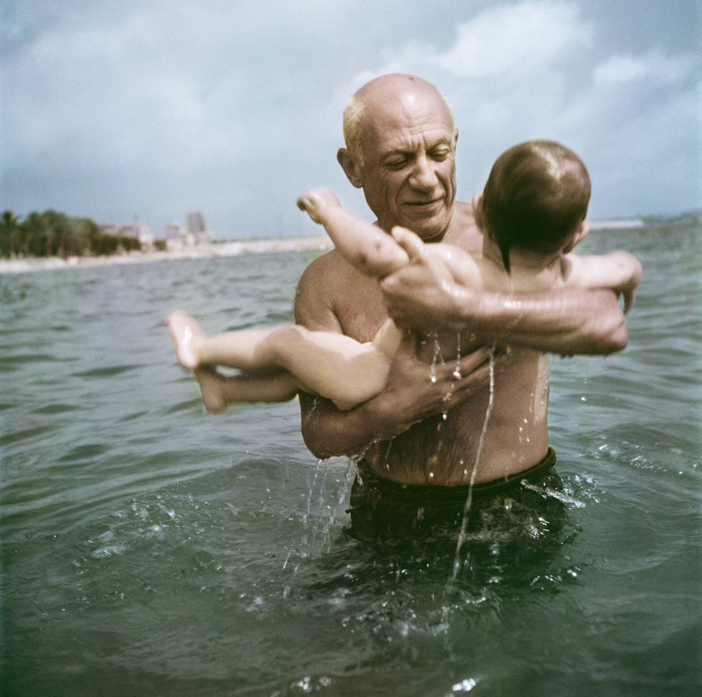 Robert Capa, Pablo Picasso playing in the water with his son Claude, Vallauris, France