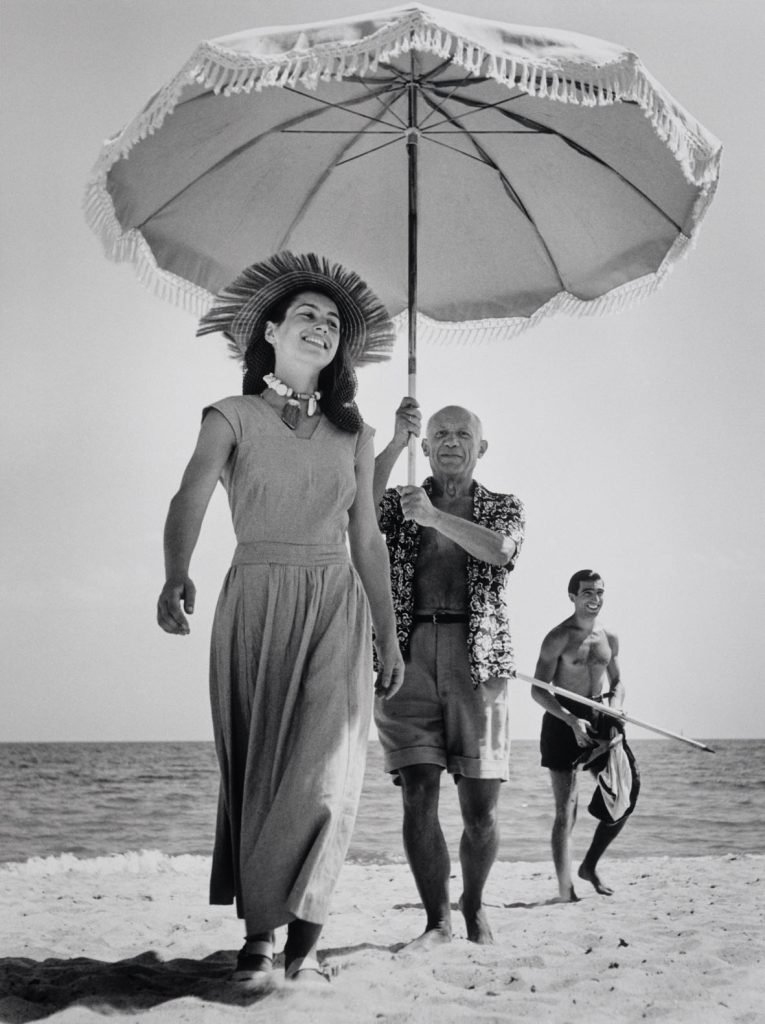 Pablo Picasso with Françoise Gilot and his nephew Javier Vilato. Golfe-Juan, France, August 1948, Robert Capa