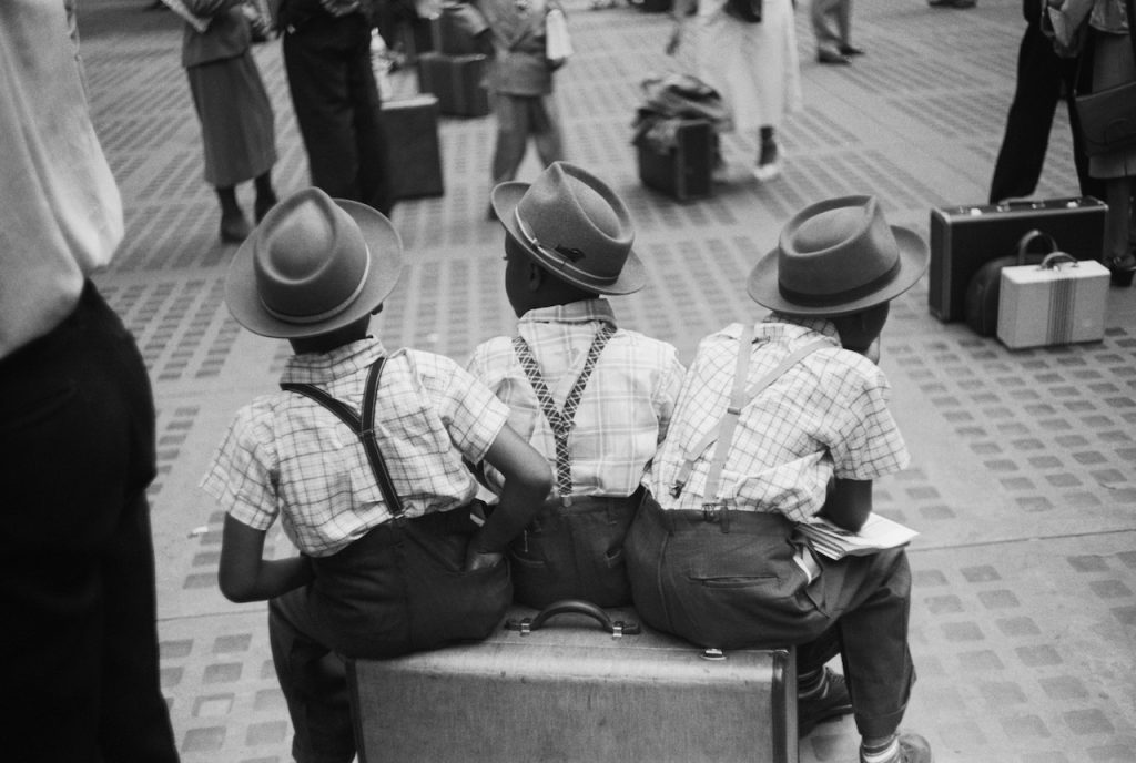 Ruth Orkin, Penn Station, boys on suitcase, NYC, 1948