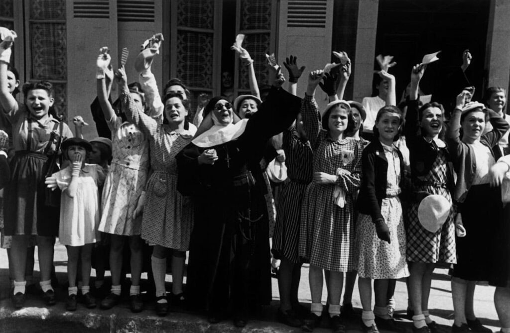 Civilians welcoming American troops just after the liberation, Alençon, France, 12 August 1944 © Robert Capa © International Center of Photography/Magnum Photos