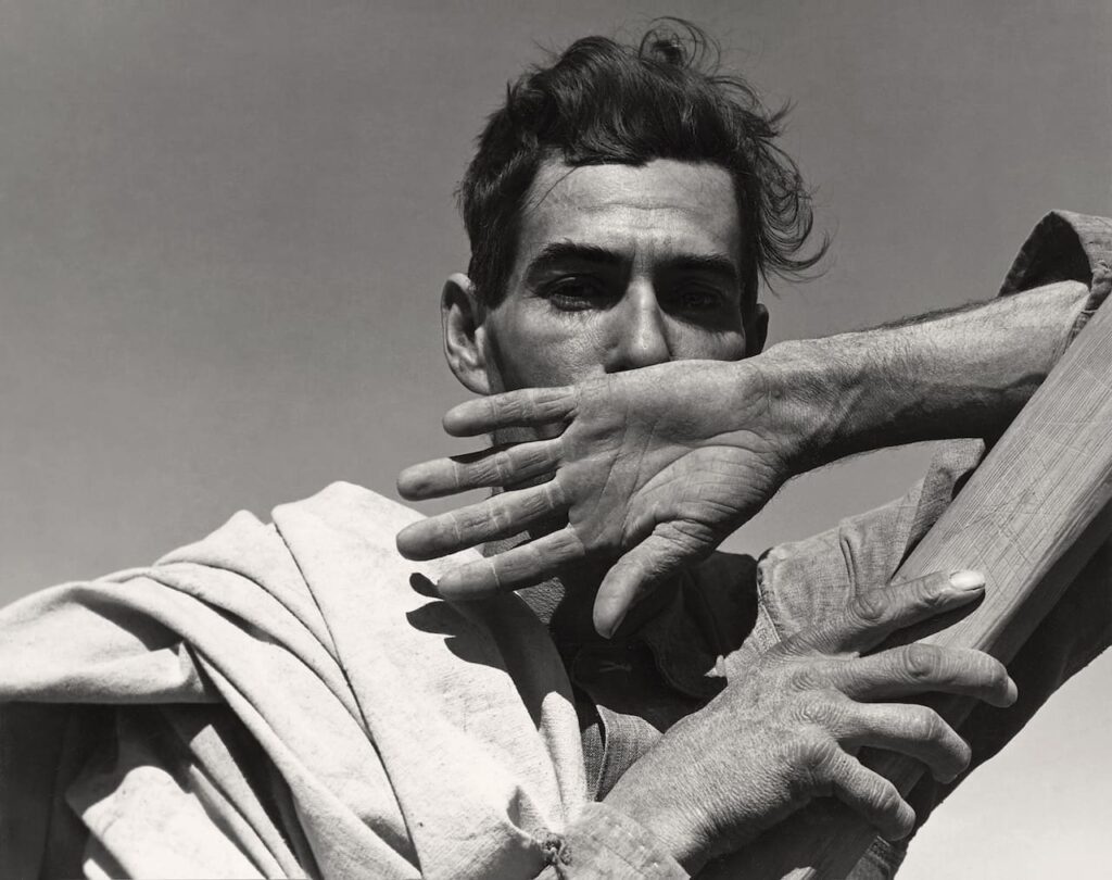 Dorothea Lange Near Coolidge, Arizona. Migratory cotton picker with his cotton sack slung over his shoulder rests at the scales before returning to work in the field. Coolidge, Arizona, 1940 The New York Public Library | Library of Congress Prints and Photographs Division Washington