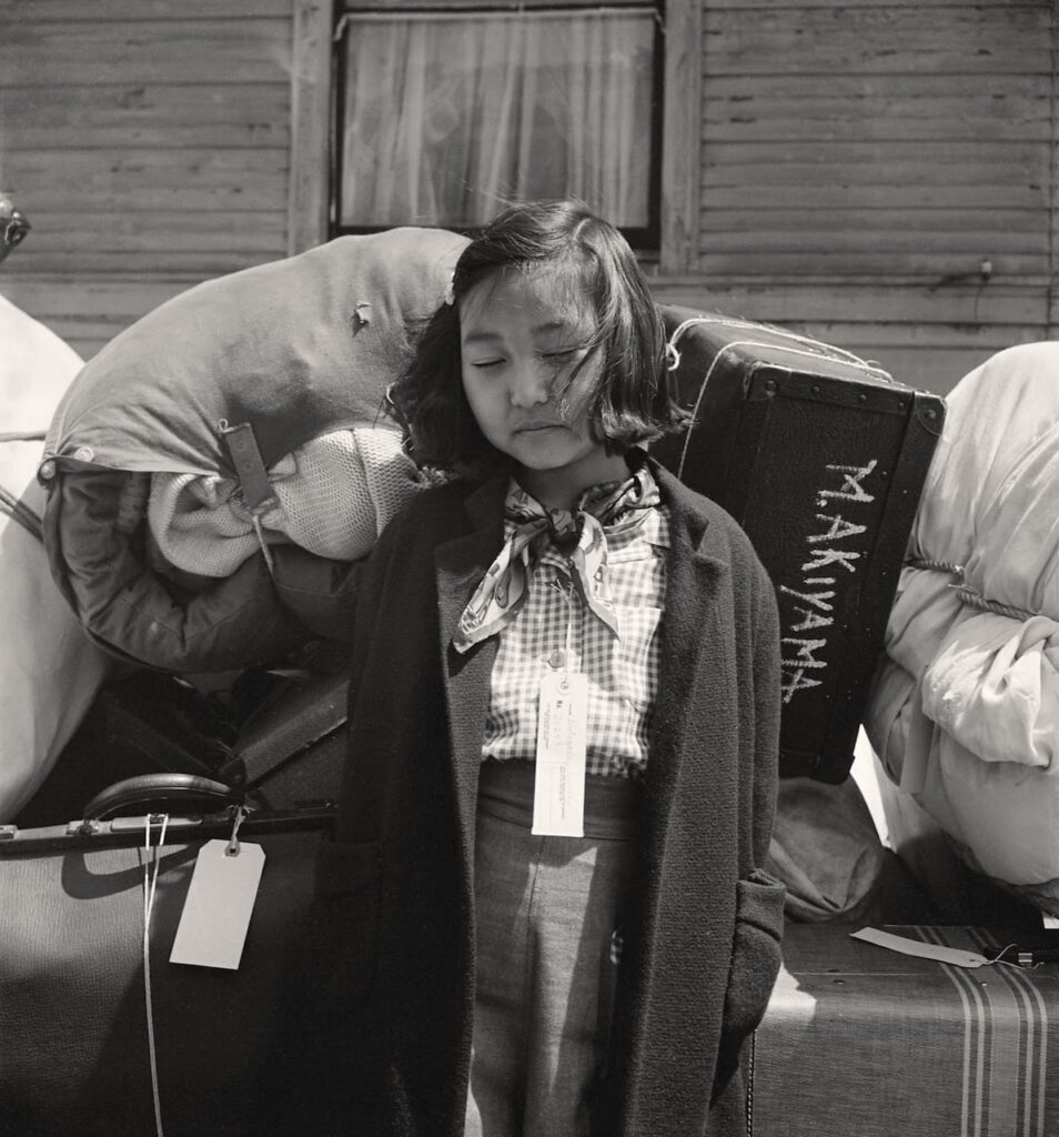 Dorothea Lange Nisei girl with baggage Oakland, California, 1942 Courtesy of the National Archives and Records Administration