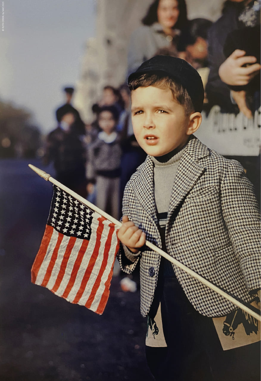Ruth Orkin, Boy with flag, 1949, © RUTH ORKIN, by SIAE 2023