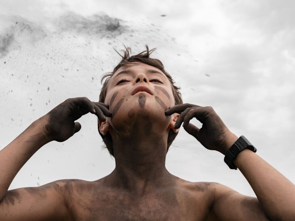 Pietro with ashes, at a nature immersion camp, Italy, 2021 Series: Constant Bloom © Lucas Foglia and Micamera